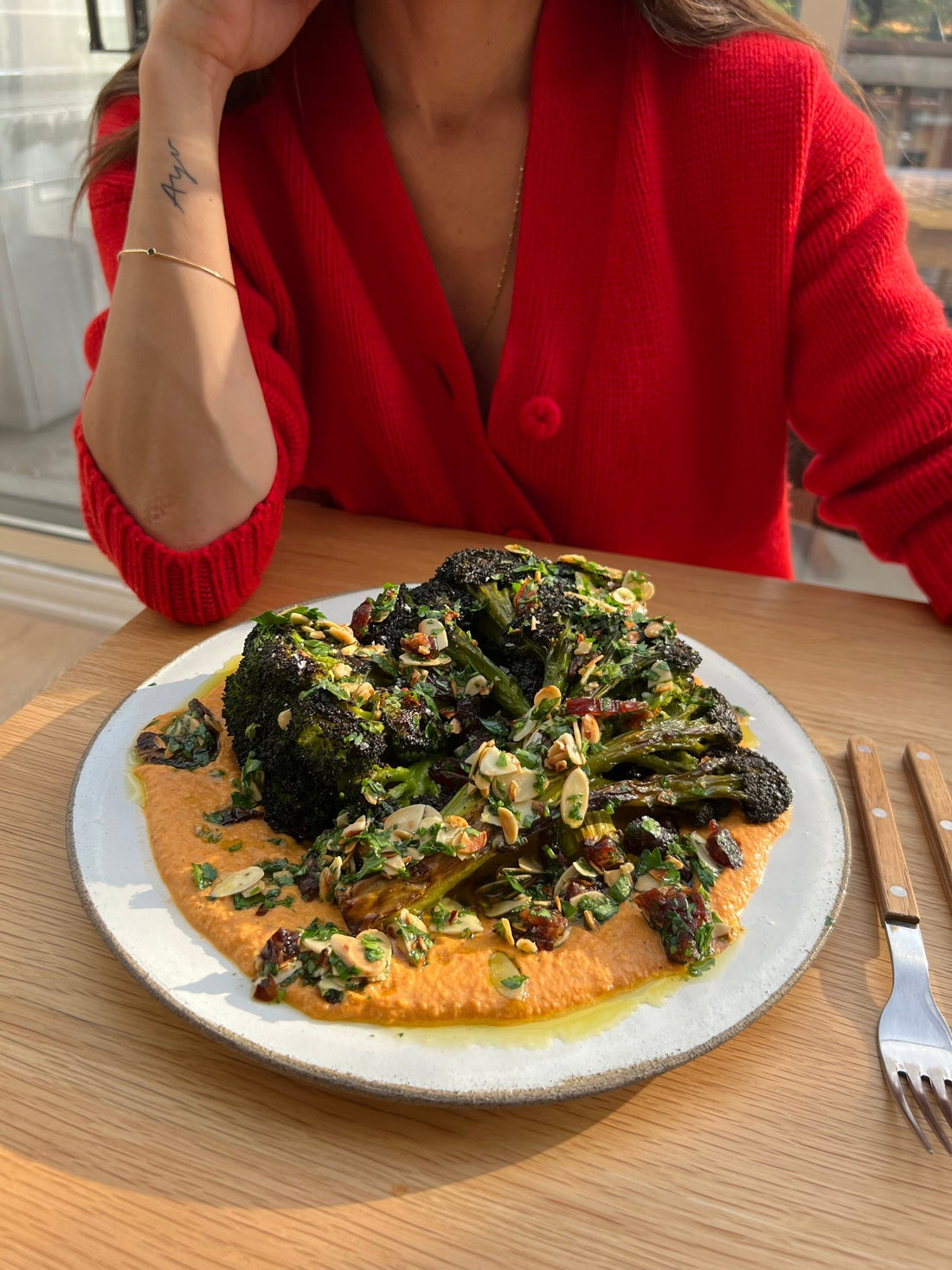 Whole Roasted Broccoli with Romesco, Almonds and Dates