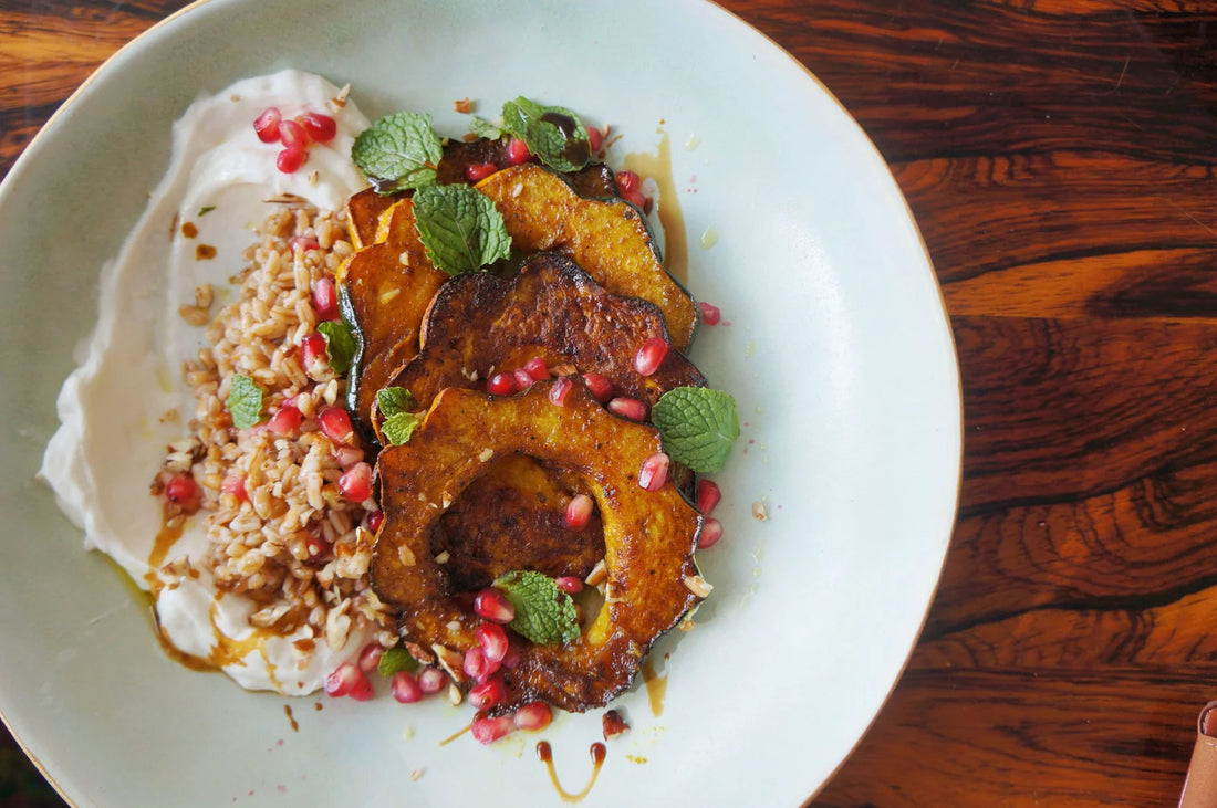 Curry Roasted Acorn Squash With Yogurt, Farro Tabouli, Fresh Mint & Pomegranate