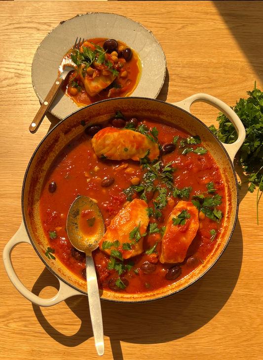 Harissa puttanesca poached sea bass and chickpeas